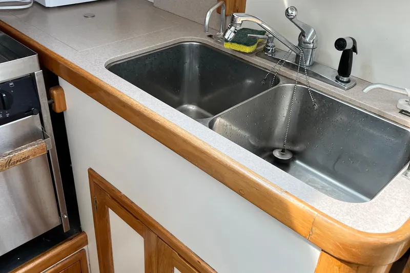 Spirit Yacht Photos Pics Kitchen sink area in a 2001 Cabo Rico Northeast 400 yacht.
