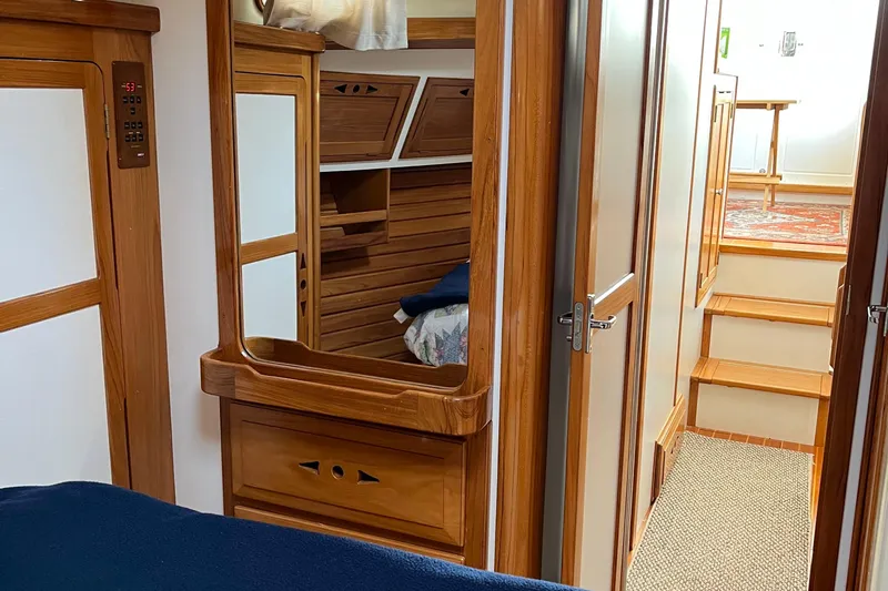 Spirit Yacht Photos Pics Interior of 2001 Cabo Rico Northeast 400 yacht with wooden cabinetry and cozy cabin space.