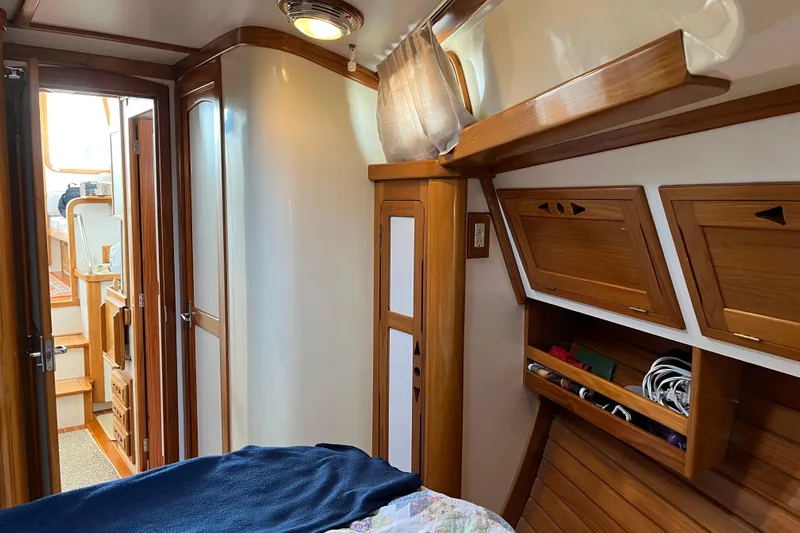 Spirit Yacht Photos Pics Interior of 2001 Cabo Rico Northeast 400 yacht with wooden cabinetry and cozy design.