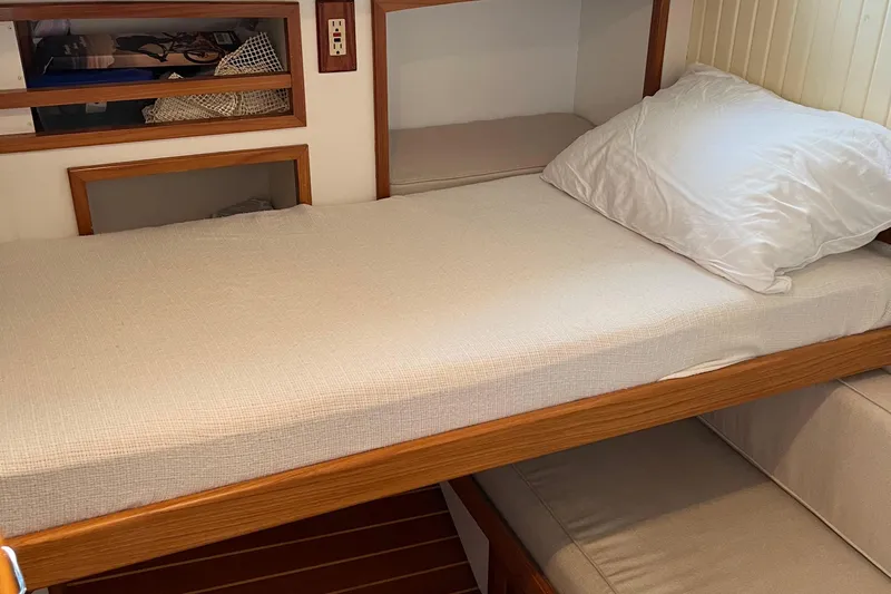 Spirit Yacht Photos Pics Interior cabin of 2001 Cabo Rico Northeast 400 with wooden bunk bed and storage.