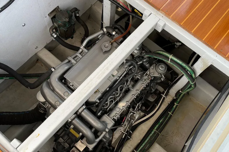 Spirit Yacht Photos Pics Engine compartment of a 2001 Cabo Rico Northeast 400 boat, showing detailed mechanical components.