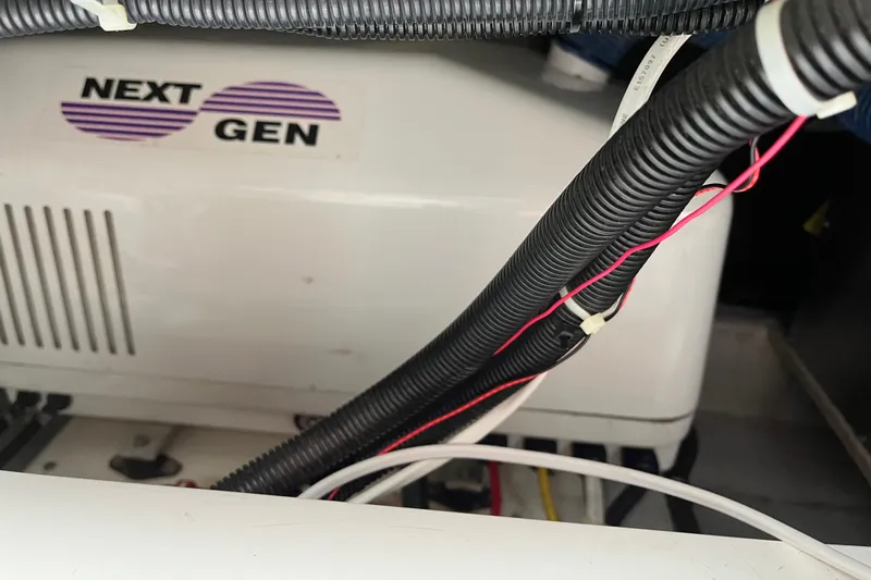 Spirit Yacht Photos Pics Engine compartment of 2001 Cabo Rico Northeast 400 with Next Gen generator and wiring.