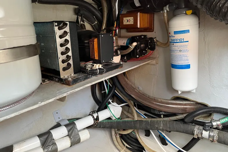 Spirit Yacht Photos Pics Engine room of a 2001 Cabo Rico Northeast 400, showcasing mechanical components and wiring.