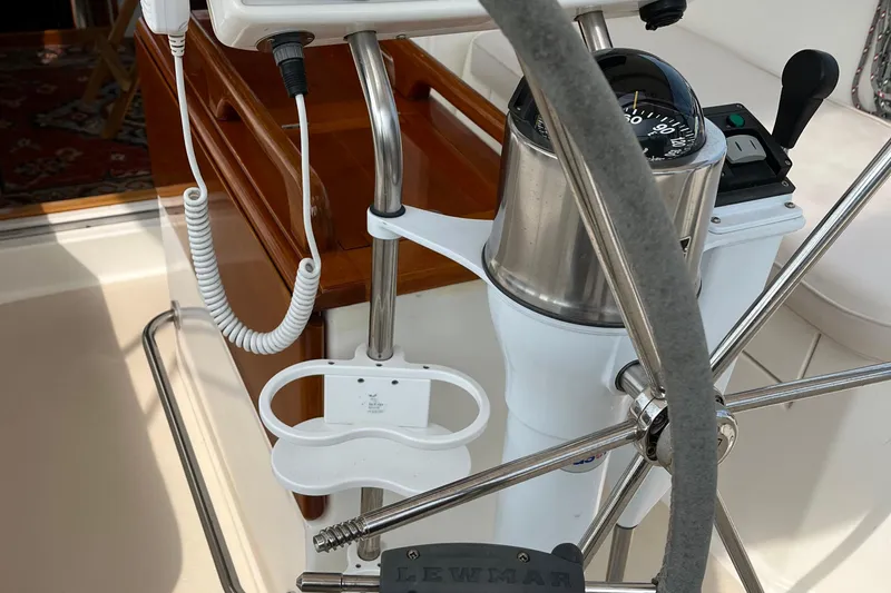 Spirit Yacht Photos Pics Steering wheel and compass on 2001 Cabo Rico Northeast 400 sailboat.