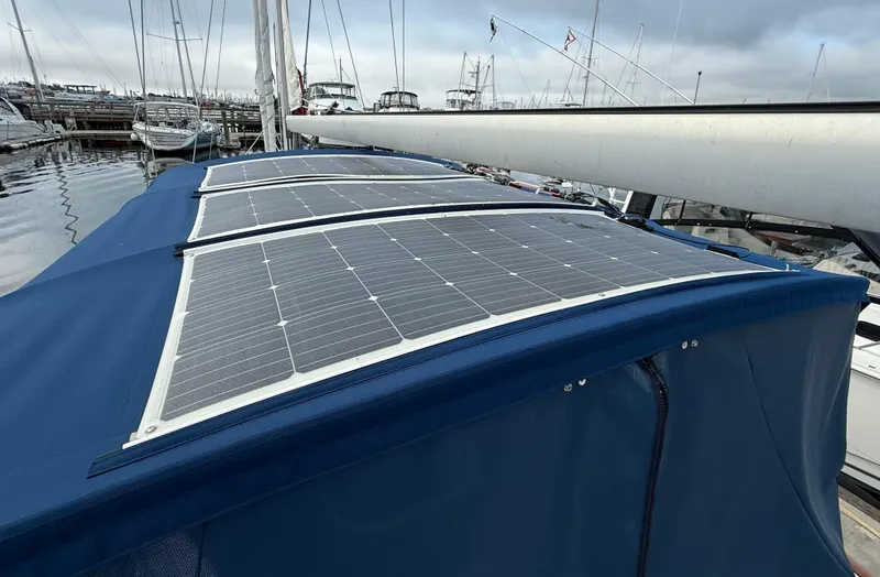 Southern Cross Yacht Photos Pics Solar panels on a 2003 Beneteau Oceanis 42CC yacht in a marina.