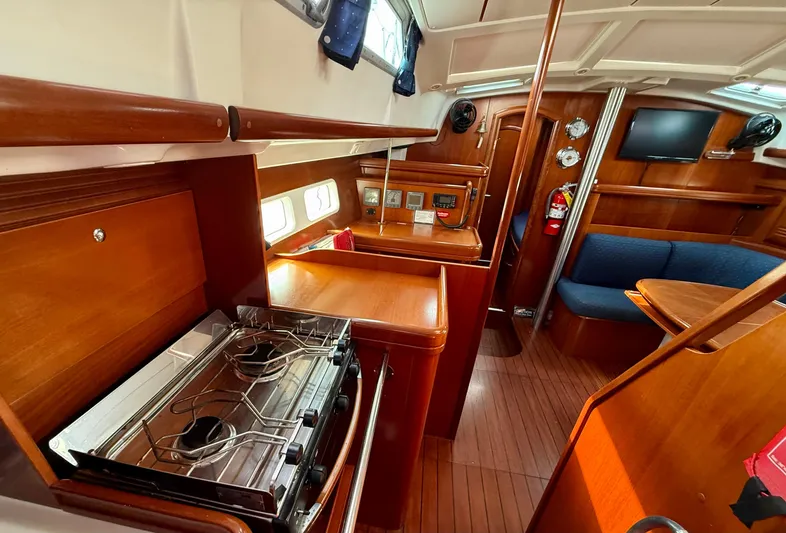 Southern Cross Yacht Photos Pics Interior of 2003 Beneteau Oceanis 42CC yacht with wood finish and modern amenities.