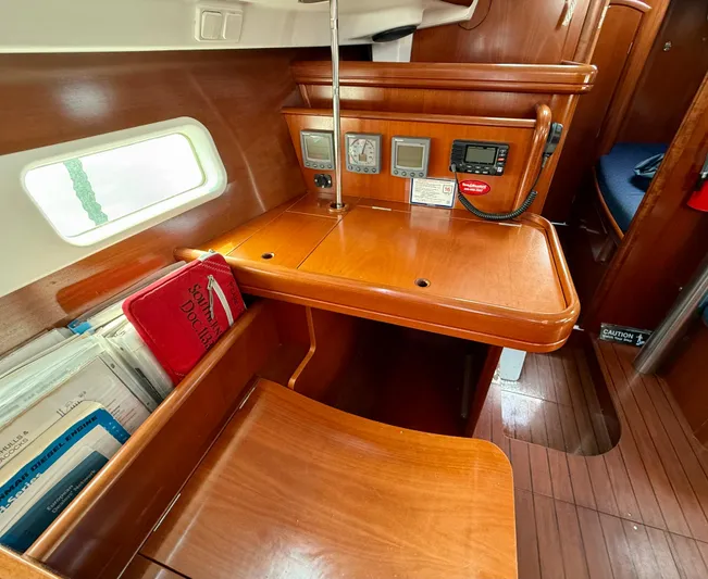 Southern Cross Yacht Photos Pics 2003 Beneteau Oceanis 42CC yacht interior with navigation station and wooden finish.