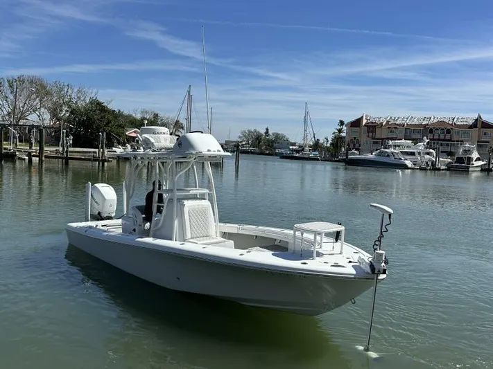  Yacht Photos Pics 2021 Barker Boatworks 26 Open in a serene marina setting.