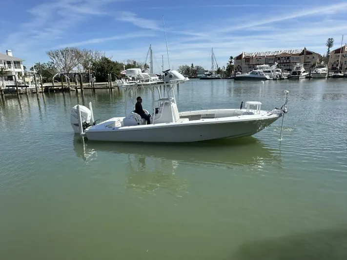  Yacht Photos Pics 2021 Barker Boatworks 26 Open in calm marina waters, clear sky background.