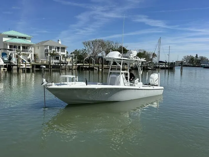  Yacht Photos Pics 2021 Barker Boatworks 26 Open in a serene marina setting.