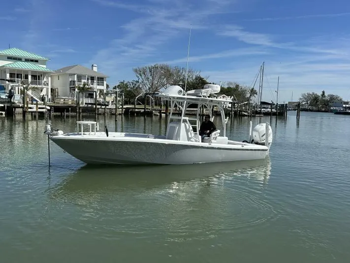  Yacht Photos Pics 2021 Barker Boatworks 26 Open in a serene marina setting.