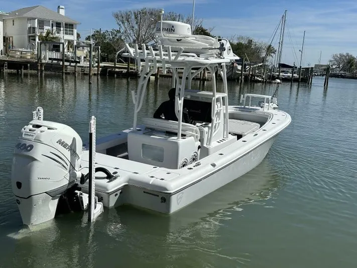  Yacht Photos Pics 2021 Barker Boatworks 26 Open in calm marina waters, featuring a powerful outboard engine.