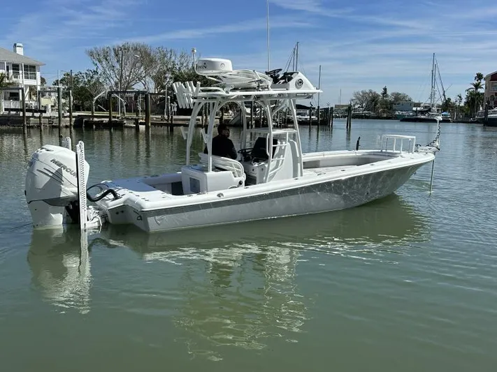  Yacht Photos Pics 2021 Barker Boatworks 26 Open in calm marina waters, showcasing sleek design and modern features.