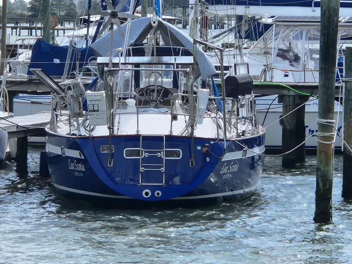 Lea Scotia Yacht Photos Pics Sailboat Taswell 43, 1989 model, docked in a marina with surrounding boats.
