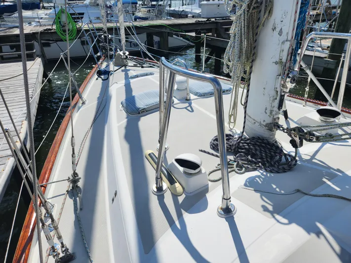 Lea Scotia Yacht Photos Pics 1989 Taswell 43 sailboat deck with rigging and mooring lines at a marina.