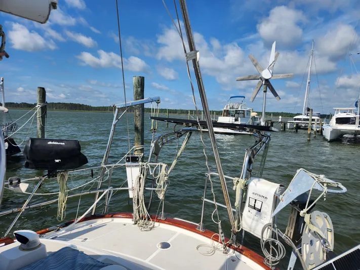 Lea Scotia Yacht Photos Pics Sailboat deck view, Taswell 43, 1989, docked with clear skies and water.