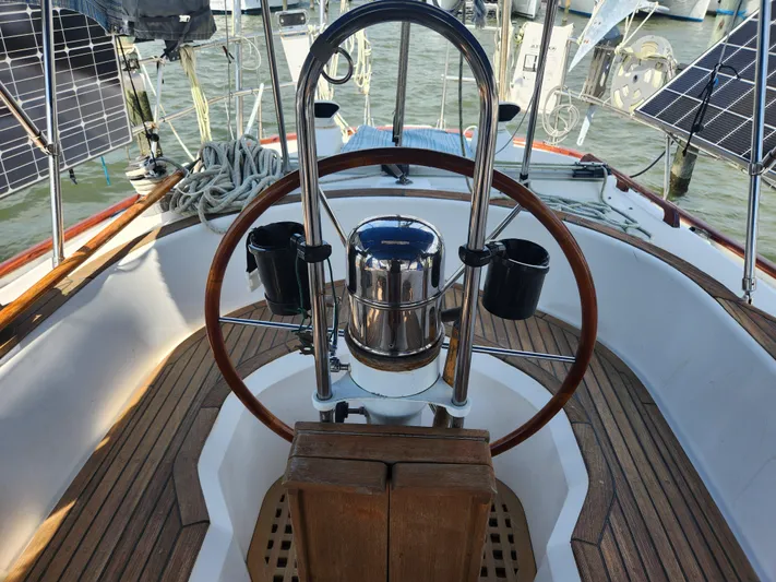 Lea Scotia Yacht Photos Pics Cockpit of 1989 Taswell 43 sailboat with wooden steering wheel and solar panels.
