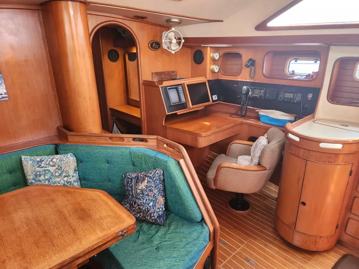 Lea Scotia Yacht Photos Pics Interior of 1989 Taswell 43 yacht with wooden furnishings and navigation station.
