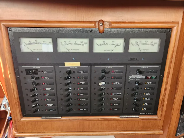 Lea Scotia Yacht Photos Pics Electrical control panel on a 1989 Taswell 43 yacht, featuring volt and amp meters.