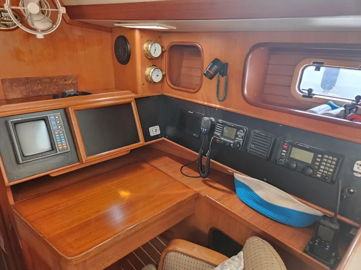 Lea Scotia Yacht Photos Pics Navigation station of 1989 Taswell 43 yacht with instruments and wooden finish.