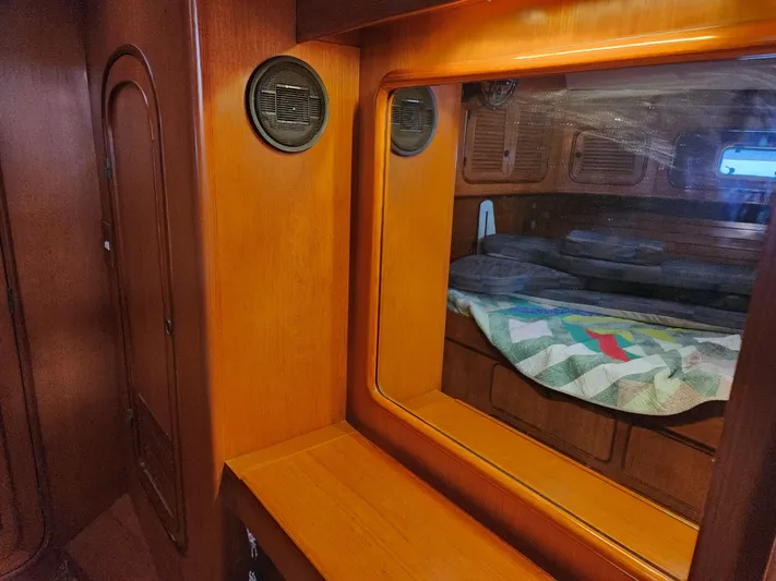 Lea Scotia Yacht Photos Pics Interior of 1989 Taswell 43 yacht with wooden finish and cozy sleeping area.