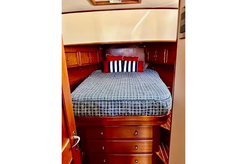 No Rules Yacht Photos Pics Luxurious cabin interior of 2003 Grand Banks Eastbay 43 HX with cozy bedding.