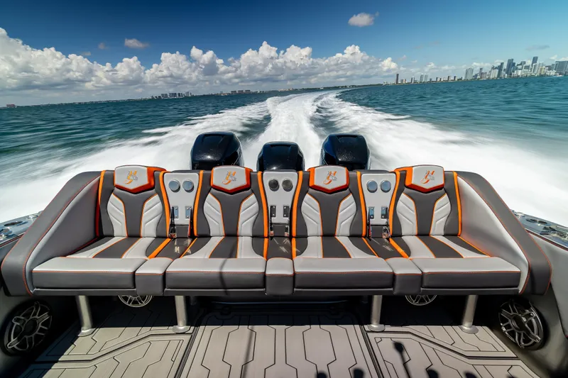  Yacht Photos Pics 2012 Yellowfin 39 boat with stylish seating, cruising on open water under a clear sky.