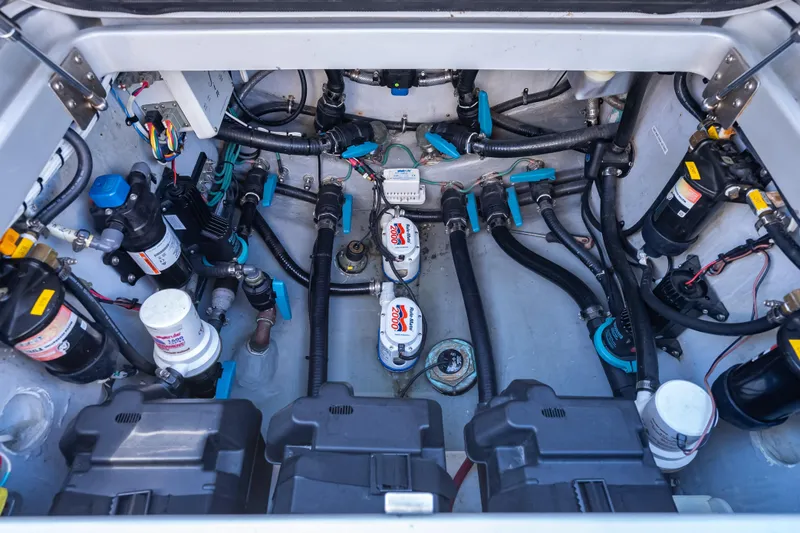  Yacht Photos Pics Engine compartment of a 2012 Yellowfin 39 boat, showcasing complex wiring and components.