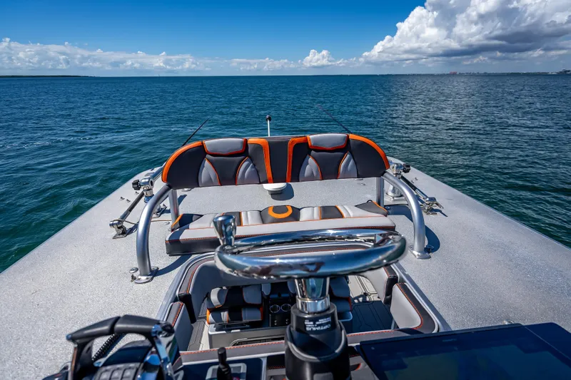  Yacht Photos Pics 2012 Yellowfin 39 boat on open water, featuring sleek seating and steering wheel.