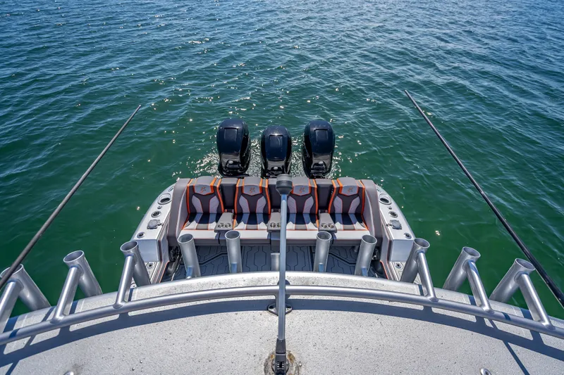  Yacht Photos Pics 2012 Yellowfin 39 boat with triple outboard engines on open water.