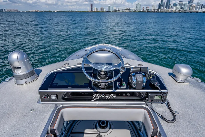  Yacht Photos Pics 2012 Yellowfin 39 boat helm with city skyline in the background.