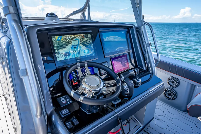  Yacht Photos Pics Steering console of a 2012 Yellowfin 39 boat with advanced navigation displays.