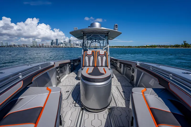  Yacht Photos Pics 2012 Yellowfin 39 boat interior with city skyline in background, under clear blue sky.