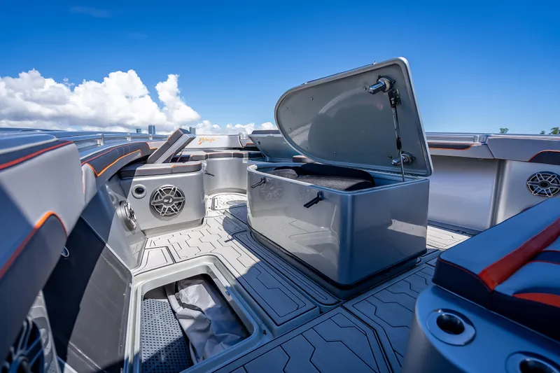  Yacht Photos Pics 2012 Yellowfin 39 boat interior with open storage, sleek design, and blue sky background.