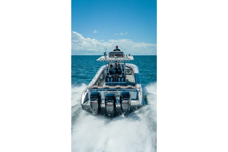  Yacht Photos Pics 2012 Yellowfin 39 boat cruising on open water with powerful engines.