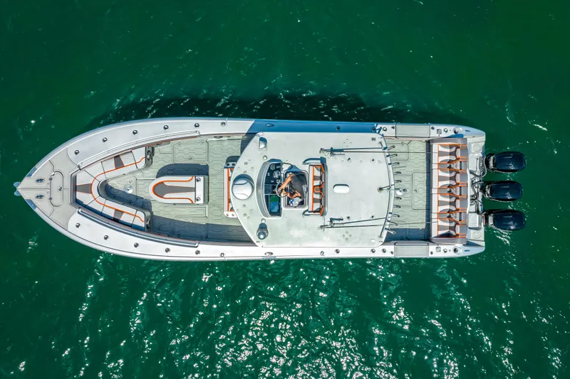  Yacht Photos Pics Aerial view of 2012 Yellowfin 39 boat on clear green water.