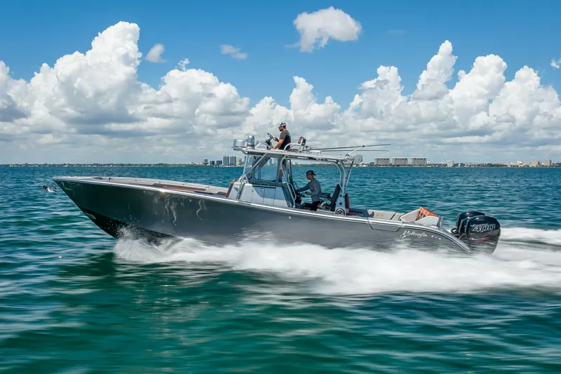  Yacht Photos Pics 2012 Yellowfin 39 boat cruising on open water under a clear blue sky.
