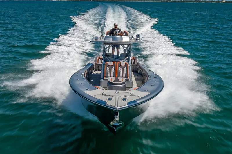  Yacht Photos Pics 2012 Yellowfin 39 boat cruising on open water, leaving a wake trail.