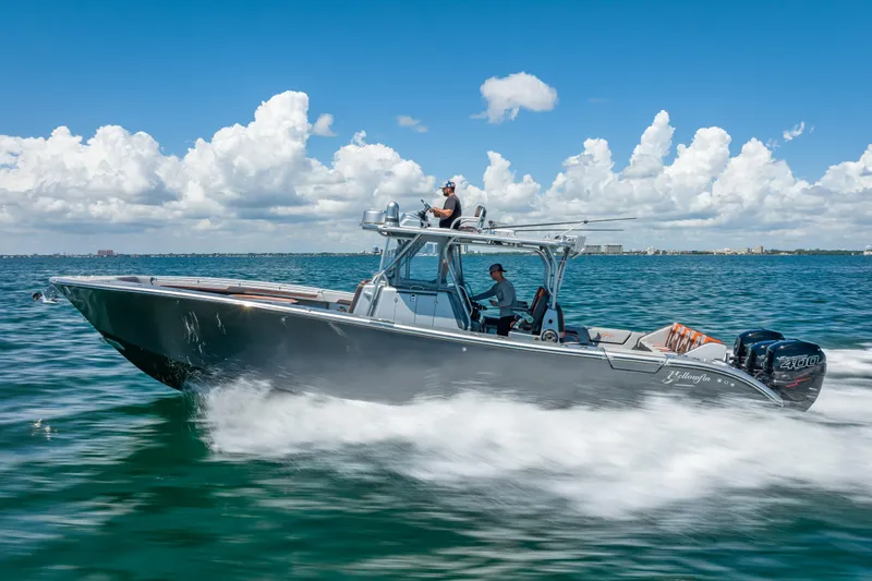  Yacht Photos Pics 2012 Yellowfin 39 boat cruising on open water under a clear blue sky.