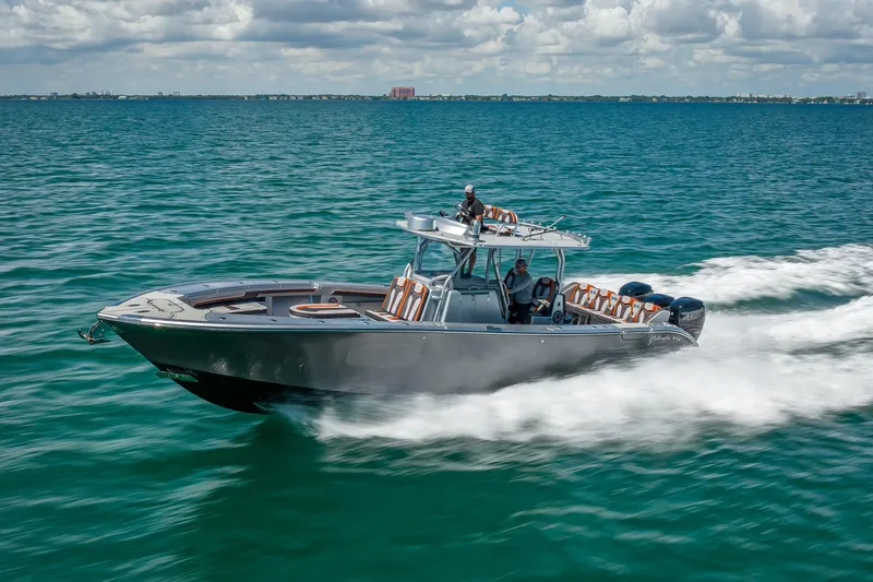  Yacht Photos Pics 2012 Yellowfin 39 boat cruising on open water under a cloudy sky.