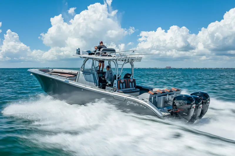  Yacht Photos Pics 2012 Yellowfin 39 boat speeding on ocean under clear blue sky.