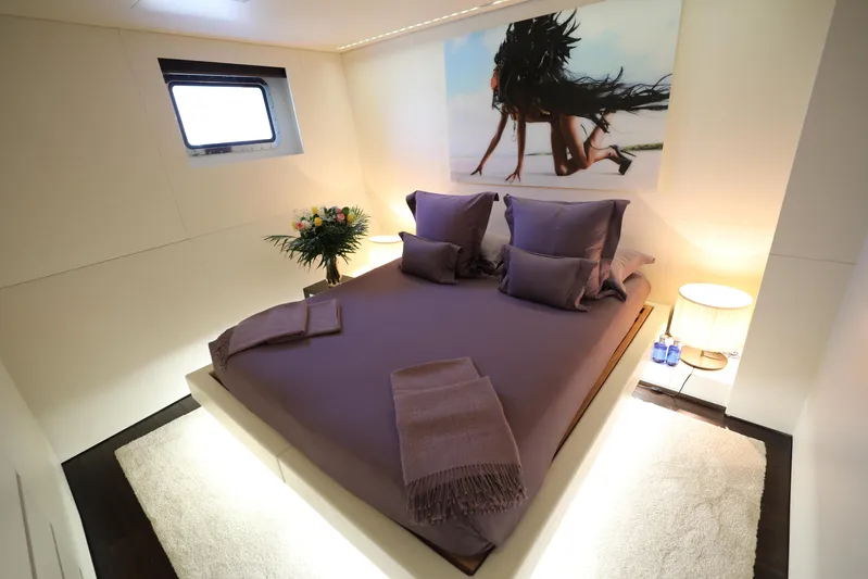 Tribu Yacht Photos Pics Luxurious bedroom on 2007 Mondomarine Explorer yacht with elegant decor and modern amenities.