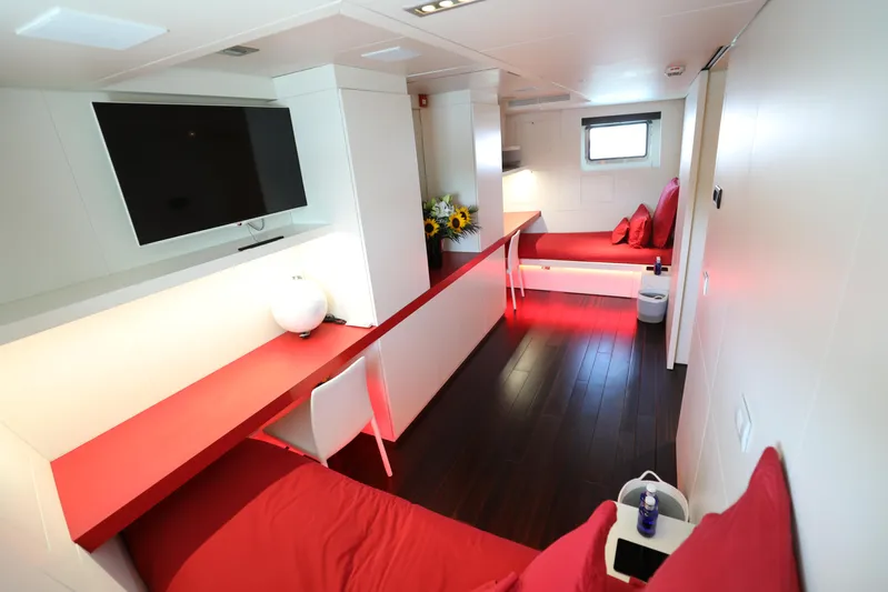 Tribu Yacht Photos Pics Luxurious interior of 2007 Mondomarine Explorer yacht with modern red and white decor.