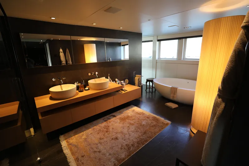 Tribu Yacht Photos Pics Luxurious bathroom on 2007 Mondomarine Explorer yacht with double sinks and freestanding tub.