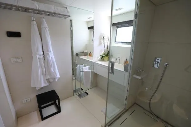 Tribu Yacht Photos Pics Luxurious bathroom on 2007 Mondomarine Explorer yacht, featuring modern fixtures and elegant design.