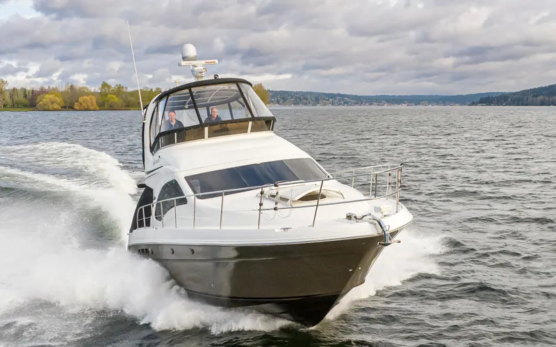  Yacht Photos Pics 2006 Sea Ray 44 Sedan Bridge cruising on choppy waters.