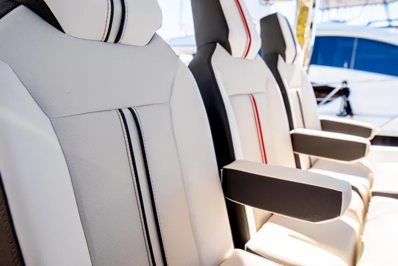 Nauti Brigi Gull Yacht Photos Pics Luxury seating on 2021 Jeanneau Leader 12.5 WA boat, featuring stylish upholstery and armrests.