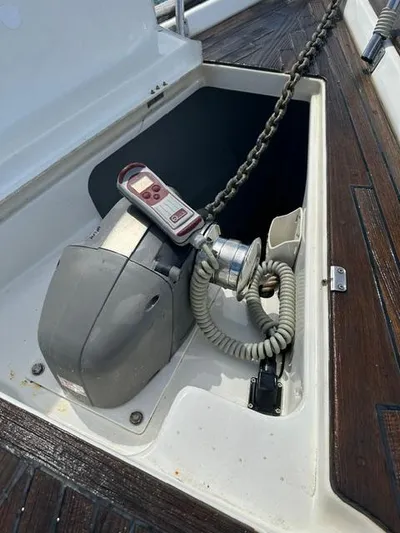 Nemesis Yacht Photos Pics Anchor windlass on 2005 Beneteau Oceanis 473 yacht deck with chain and control.