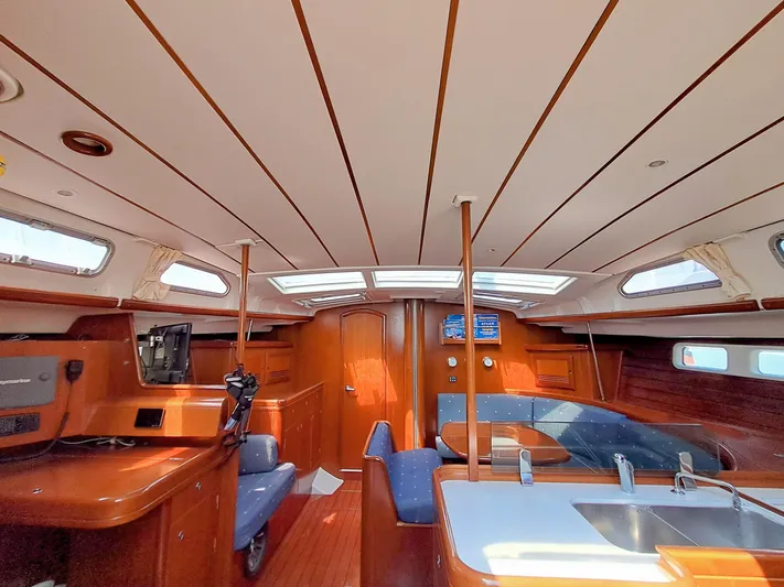 Nemesis Yacht Photos Pics Interior of 2005 Beneteau Oceanis 473 sailboat, featuring wood finish and modern amenities.