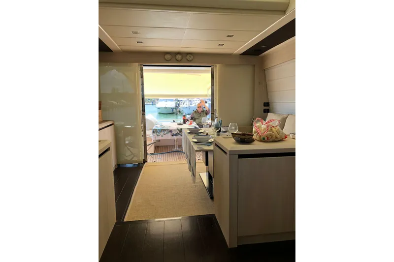  Yacht Photos Pics Luxurious interior of 2011 Cayman Yachts 60 HT with elegant dining setup.